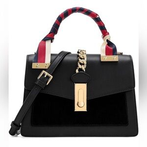 Leather top handle bag with gold hardware and crossbody strap, matching …